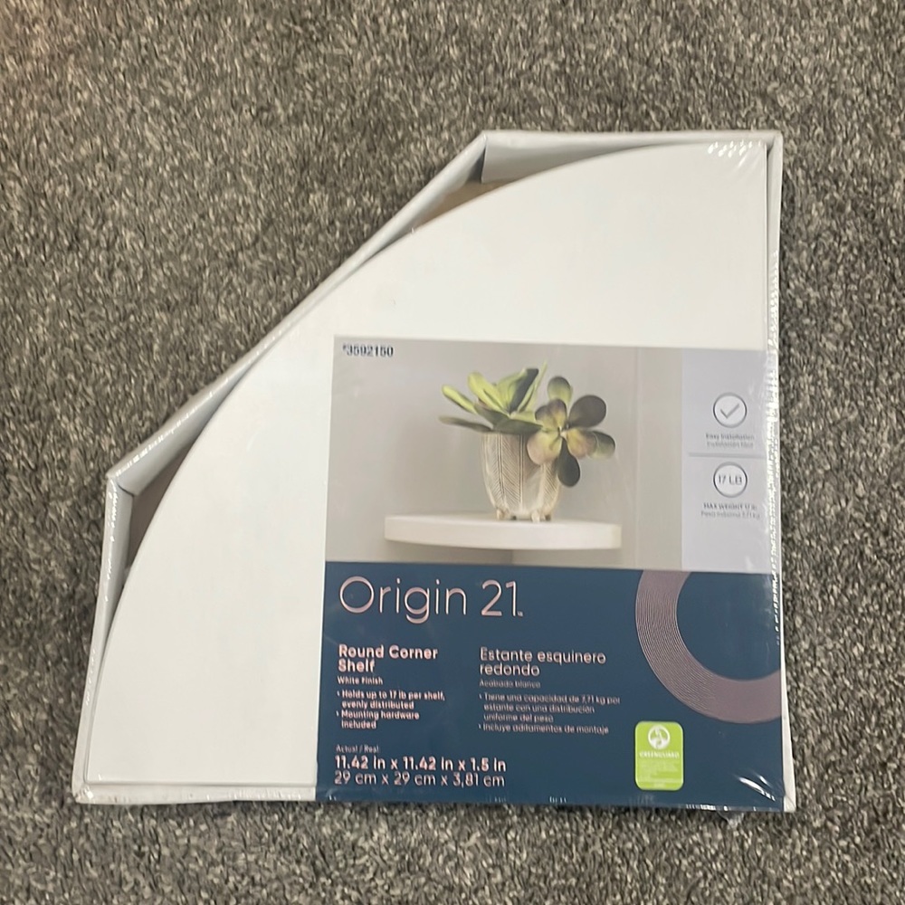 Two white floating corner shelves